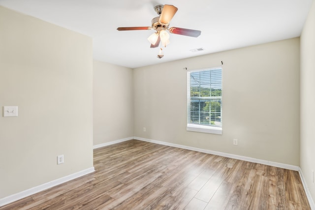 spare room featuring ceiling fan and light wood-type flooring