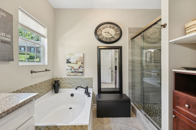 bathroom featuring vanity, separate shower and tub, and tile patterned floors