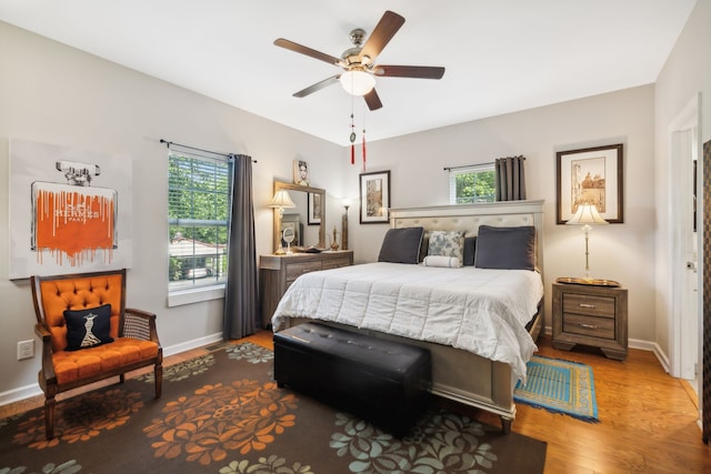 bedroom with hardwood / wood-style floors and ceiling fan