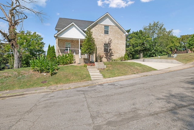 view of front of home with a front lawn and covered porch