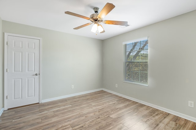 unfurnished room with light hardwood / wood-style flooring and ceiling fan