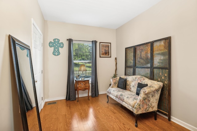 living area with wood-type flooring