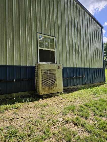 view of home's exterior with ac unit