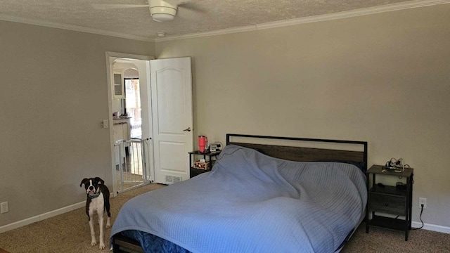 carpeted bedroom with a textured ceiling, ceiling fan, and ornamental molding