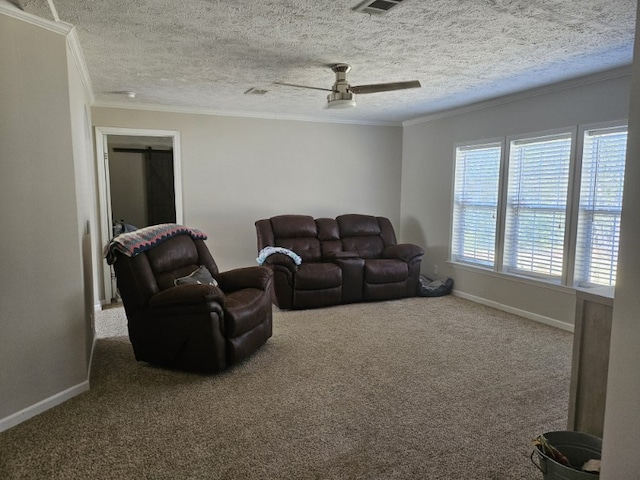 carpeted living room featuring a textured ceiling, crown molding, and ceiling fan