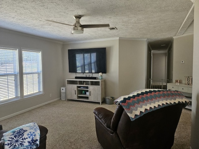 living room with ceiling fan, ornamental molding, carpet, and a textured ceiling