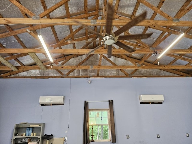 interior space with an AC wall unit and beam ceiling