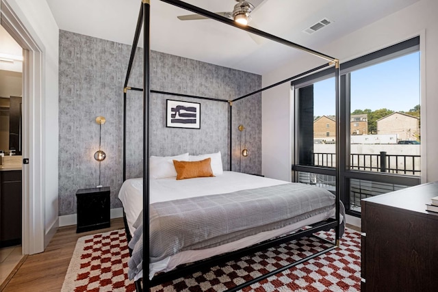 bedroom featuring light hardwood / wood-style flooring and ceiling fan