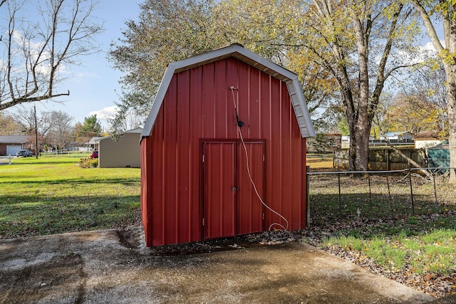 view of outdoor structure with a lawn