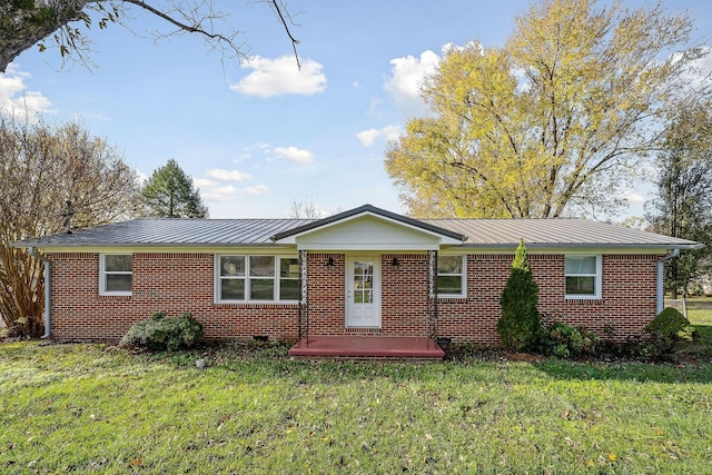 118 Van Buren St, Mcminnville, TN 37110 - single story home featuring brick siding, a front yard, and a metal roof