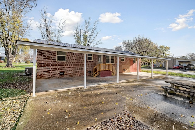 118 Van Buren St, Mcminnville, TN 37110 - rear view of property featuring brick siding, crawl space, an attached carport, and a metal roof