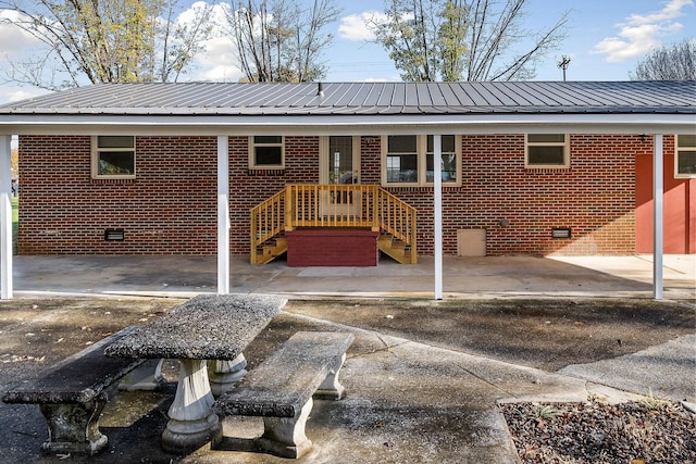 118 Van Buren St, Mcminnville, TN 37110 - back of property featuring crawl space, brick siding, and a metal roof