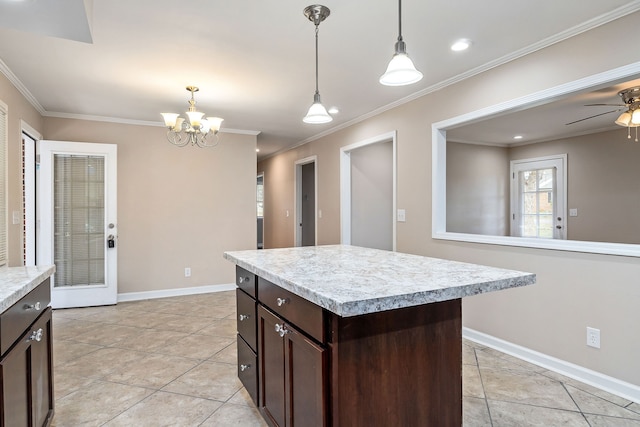 kitchen featuring dark brown cabinetry, light tile patterned floors, crown molding, pendant lighting, and a kitchen island