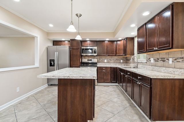 kitchen with sink, backsplash, decorative light fixtures, a kitchen island, and appliances with stainless steel finishes