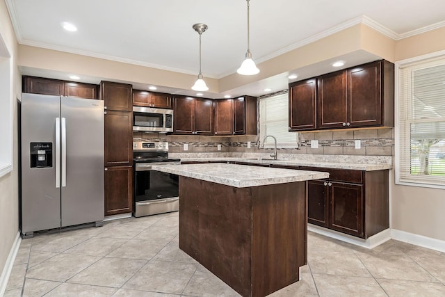 118 Van Buren St, Mcminnville, TN 37110 - kitchen with appliances with stainless steel finishes, dark brown cabinetry, decorative backsplash, light countertops, and light tile patterned floors
