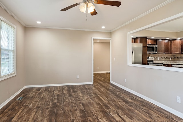 unfurnished living room with ceiling fan, dark hardwood / wood-style flooring, and ornamental molding