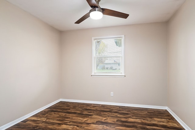 spare room with dark hardwood / wood-style floors and ceiling fan