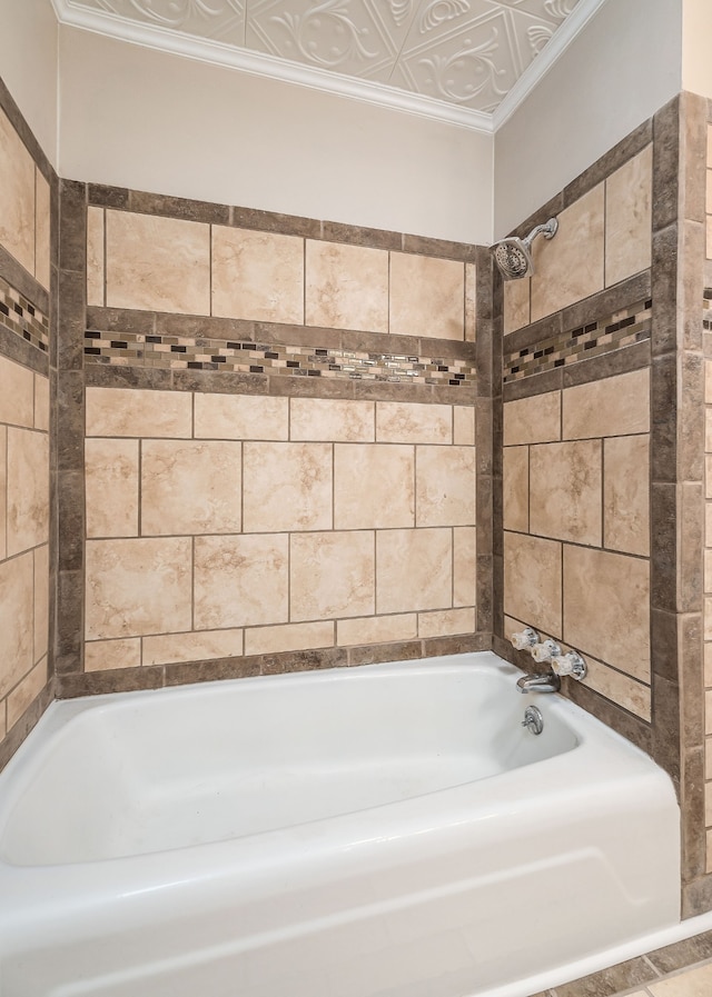 bathroom with crown molding and a tub to relax in