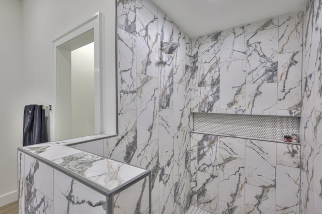 bathroom featuring tiled shower