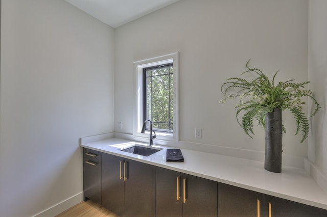 kitchen featuring sink and light wood-type flooring