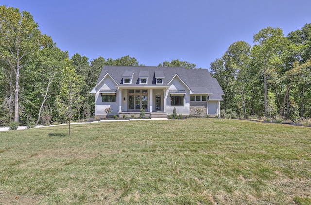 craftsman house with a front yard and a porch