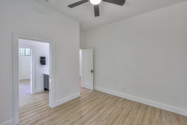 empty room featuring ceiling fan and light hardwood / wood-style flooring