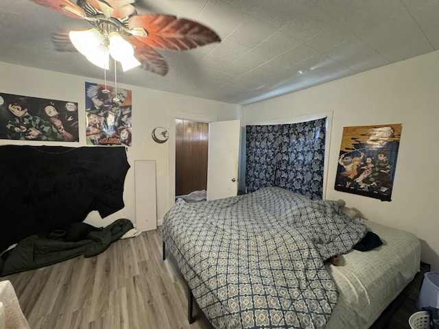 bedroom featuring ceiling fan and light wood-type flooring