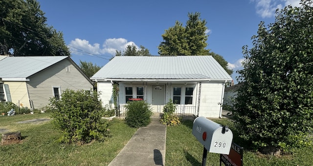 bungalow-style house with a porch and a front yard