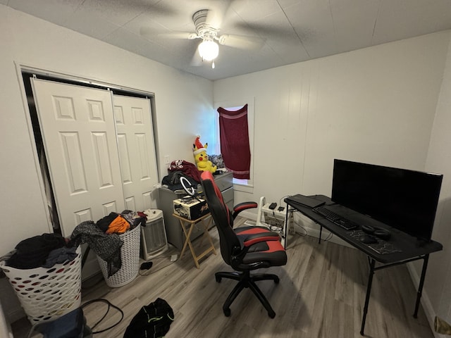 office space with wood-type flooring and ceiling fan