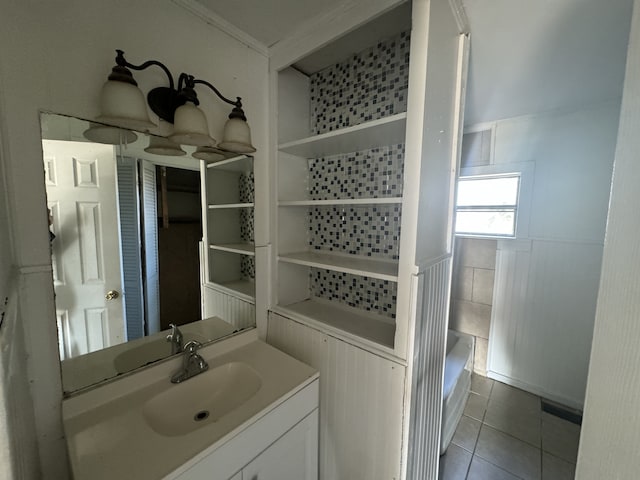 bathroom featuring crown molding, vanity, separate shower and tub, and tile patterned floors