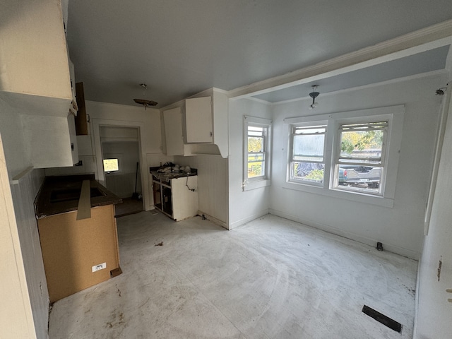 kitchen with white cabinets and black electric stovetop