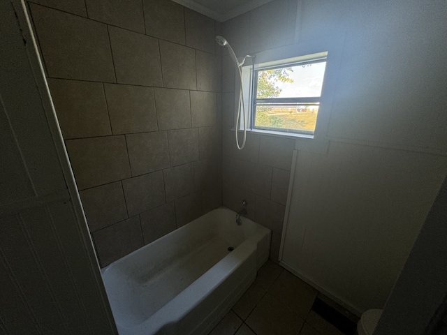 bathroom with tiled shower / bath combo and tile patterned floors