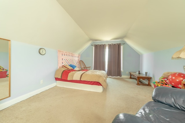 carpeted bedroom featuring vaulted ceiling