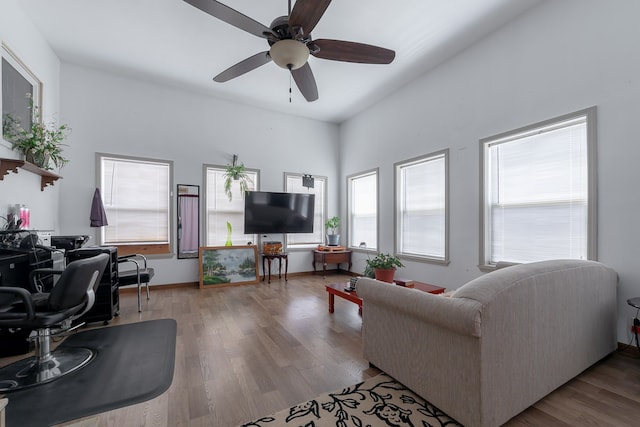 living room with ceiling fan and light hardwood / wood-style floors