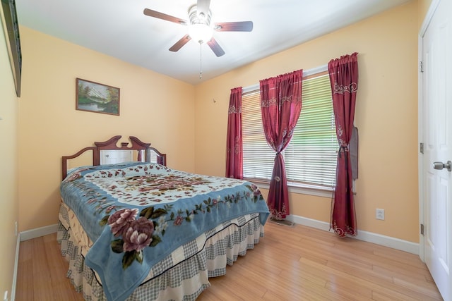 bedroom featuring light wood-type flooring and ceiling fan