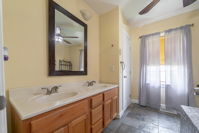 bathroom featuring vanity, ceiling fan, ornamental molding, and tile patterned floors