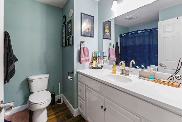 bathroom featuring a shower with curtain, wood-type flooring, toilet, and vanity