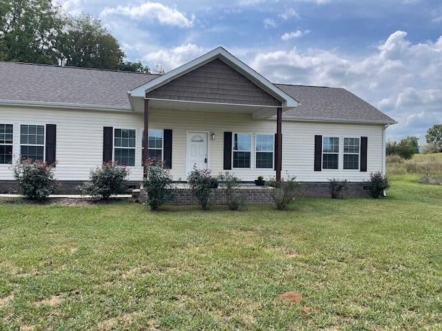 ranch-style house with a front lawn