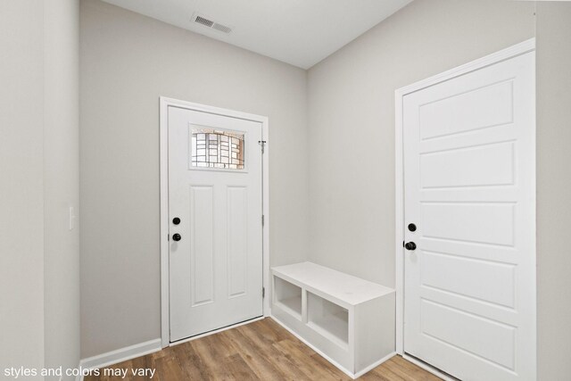 mudroom with light hardwood / wood-style floors