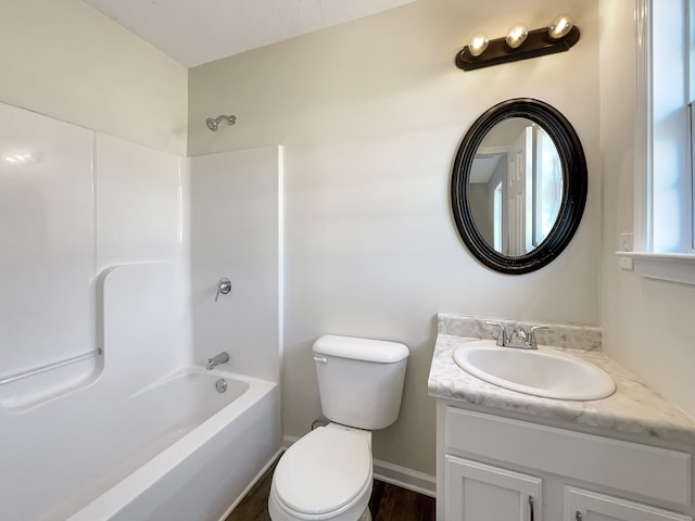 full bathroom with vanity, toilet, wood-type flooring, and  shower combination