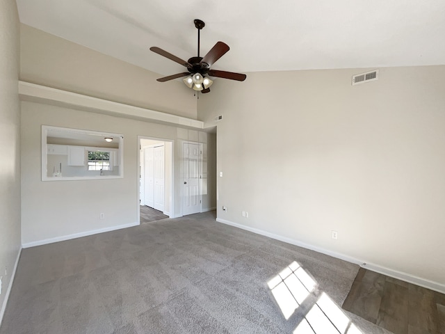 unfurnished room featuring high vaulted ceiling, ceiling fan, and carpet floors