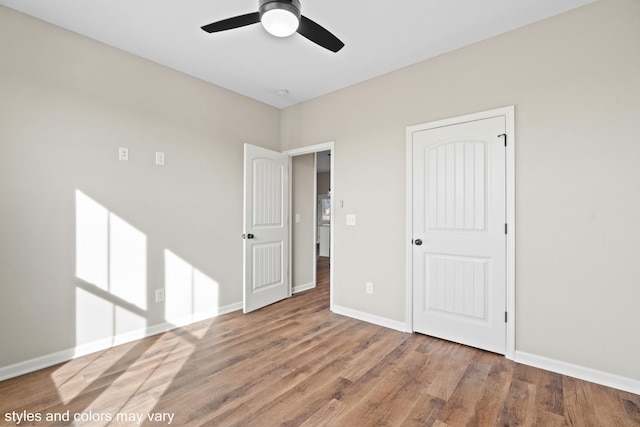 unfurnished bedroom featuring ceiling fan and wood-type flooring