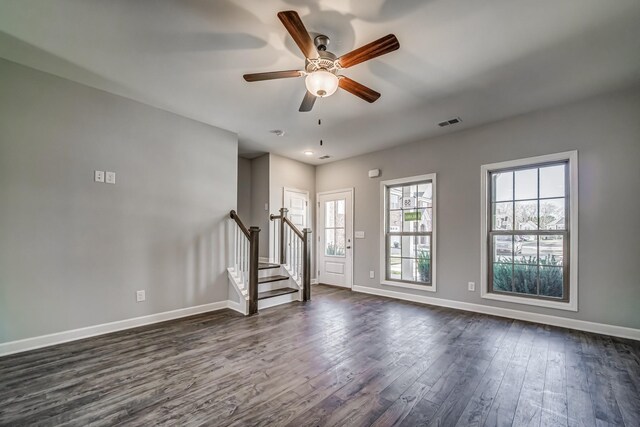 empty room featuring ceiling fan and dark hardwood / wood-style flooring