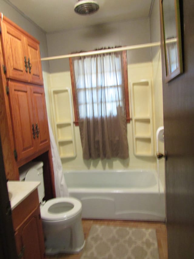 full bathroom featuring shower / washtub combination, vanity, and toilet