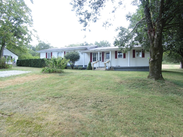 single story home with covered porch and a front lawn