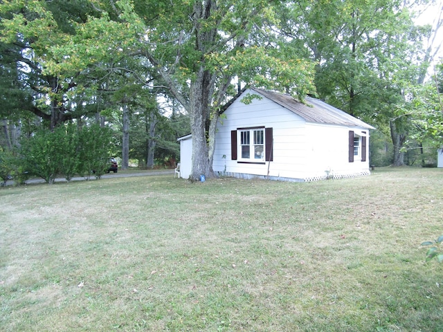 view of property exterior featuring a yard