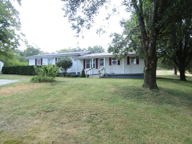 single story home with entry steps and a front lawn