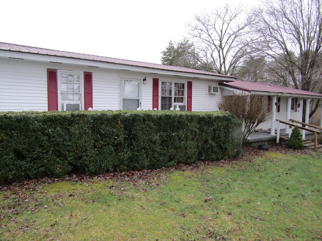 ranch-style home with a front lawn