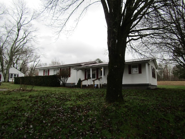 view of home's exterior featuring a yard