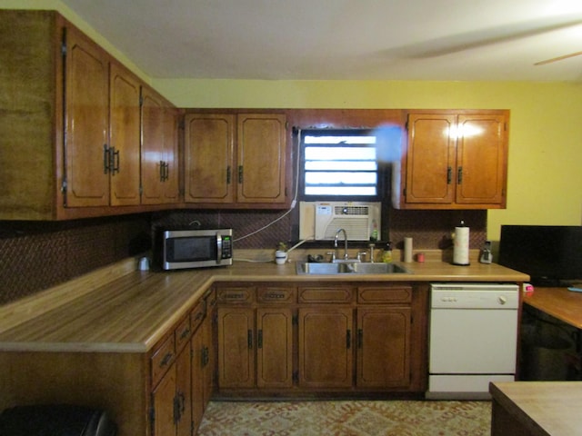 kitchen with ceiling fan, dishwasher, cooling unit, and sink